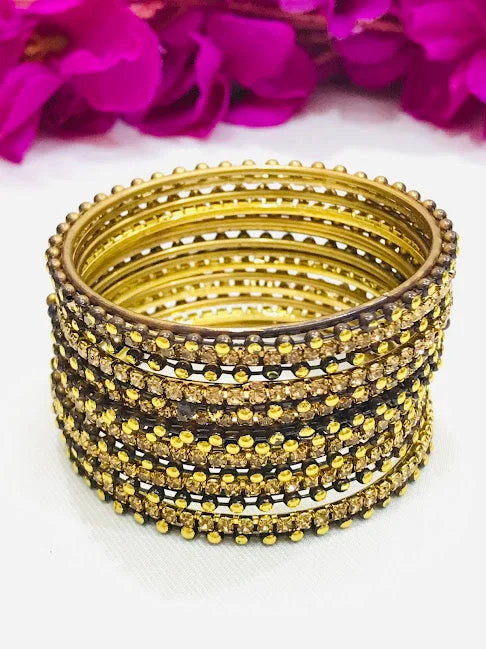 Bracelets with peridot stones for fresh green -Gorgeous Black Colored Golden Stone And Dot Designed Bangles For Girls