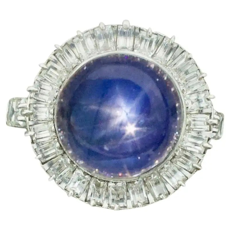 Women’s bridal rings with diamond halo settings -Blue Star Sapphire and Diamond Ring in Platinum circa 1950's