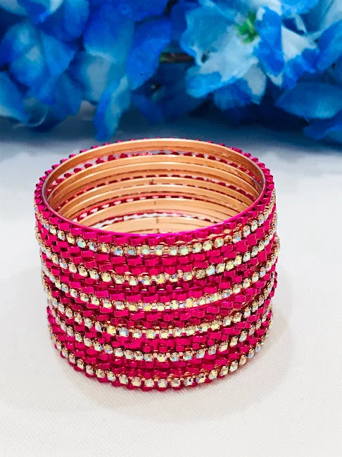 Bangles with polished onyx for bold sleekness -Stunning Pink Colored Designed White Stone Bangles For Girls