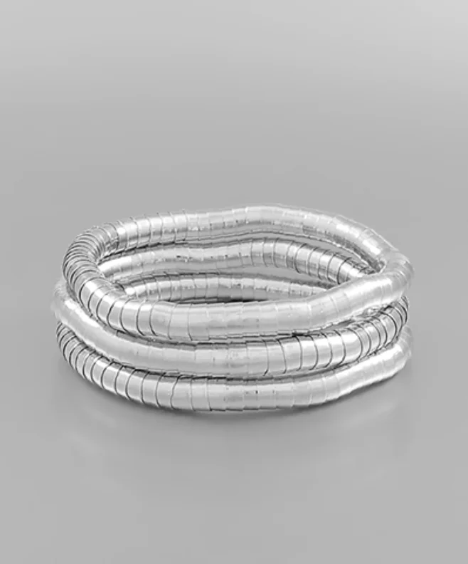 Bangles with gothic-inspired engravings for drama -The Slinky Silver Bracelet Set