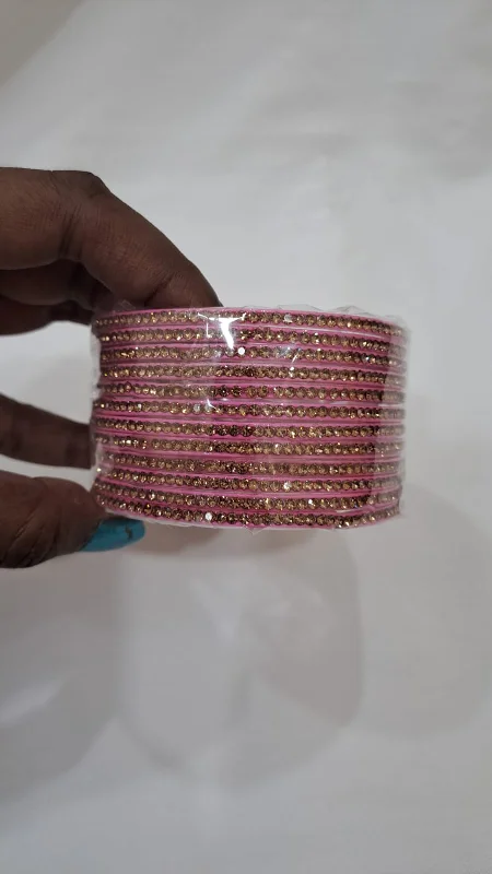 Bangles with twisted metal bands for flair -Alluring Dark Pink Color Glass Bangles With Glittering Stones For Women