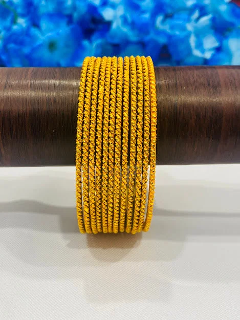 Rose gold bangles with geometric cutout designs -Fascinating Yellow Color Gold Plated Bangles With Plain Running Dots