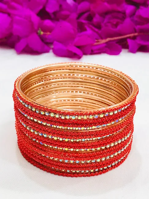 Bangles with sleek matte finish for subtlety -Dazzling Orange Colored Designed Metal White Stoned Bangles For Women