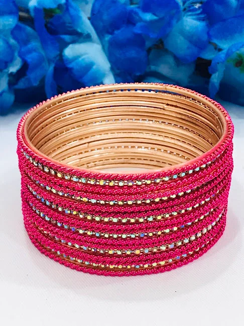 Bangles with faceted garnet for deep shine -Charming Pink Colored White Stoned Metal Bangles For Women