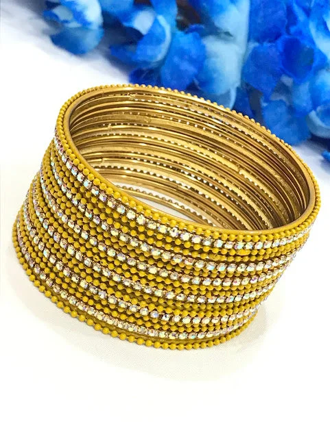 Bangles with gothic-inspired engravings for drama -Attractive Yellow Color Bangles With White Stone For Women