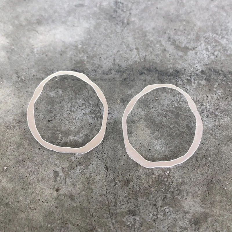 Hoop earrings with twisted metal designs for a dynamic and modern style-large thin rough cut post